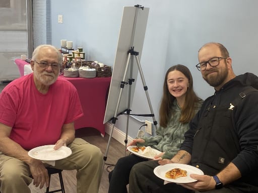 Neighbors sharing food and conversation at the Oak Park Community Social