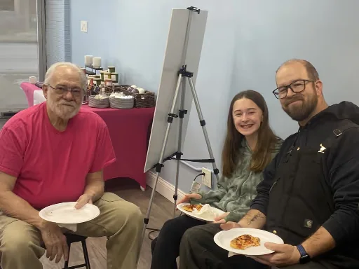 Neighbors sharing food and conversation at the Oak Park Community Social