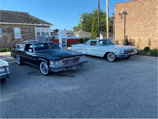 Classic cars parked outside at the Route 66 celebration